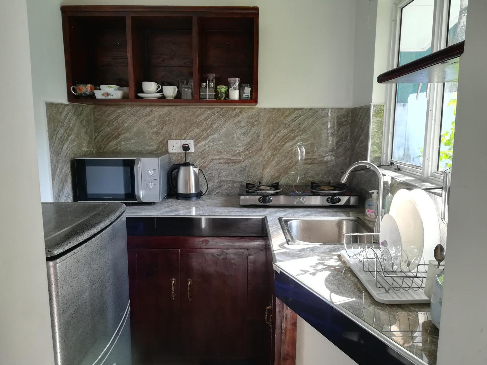 נגומבו Living Home חדר תמונה